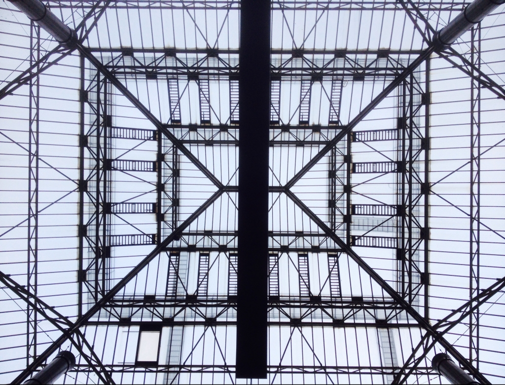A glass and steel roof from below